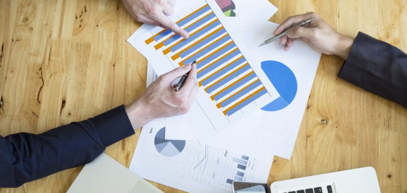 Budget vs actual analysis meeting for a nonprofit organization reviewing financial reports and budget variance data