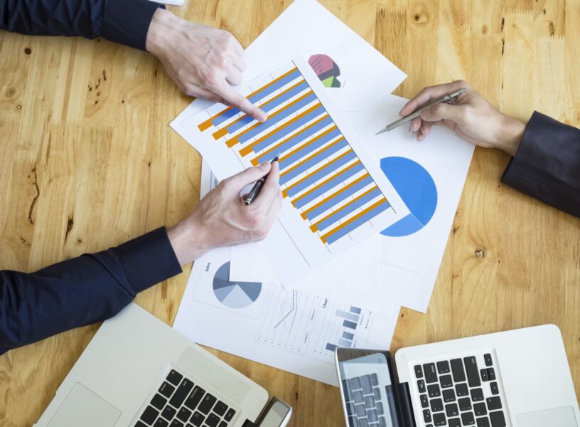 Budget vs actual analysis meeting for a nonprofit organization reviewing financial reports and budget variance data