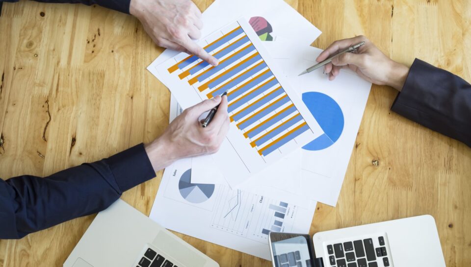 Budget vs Actual Analysis for Nonprofits Budget vs actual analysis meeting for a nonprofit organization reviewing financial reports and budget variance data